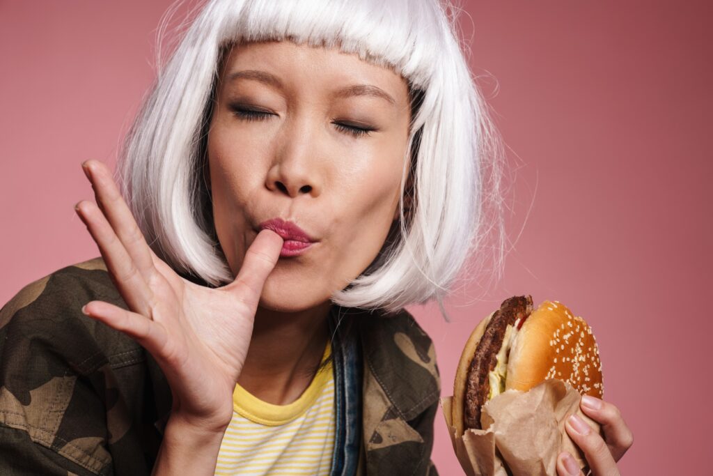 a woman eating a burger