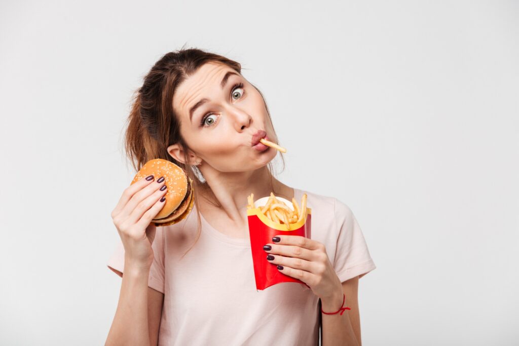 a woman enjoying junk food