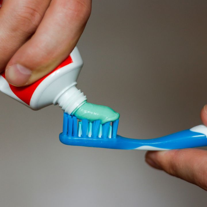 squeezing toothpaste