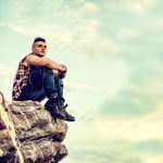 Man sitting on a mountain