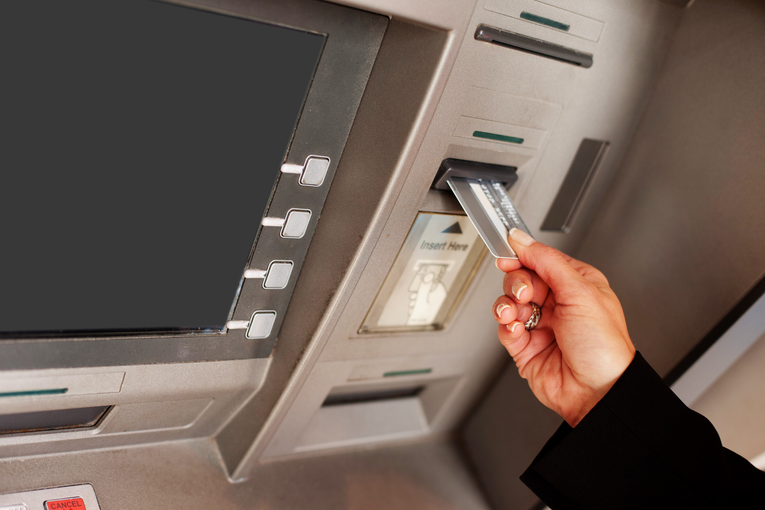 ATM Machine with hand using it