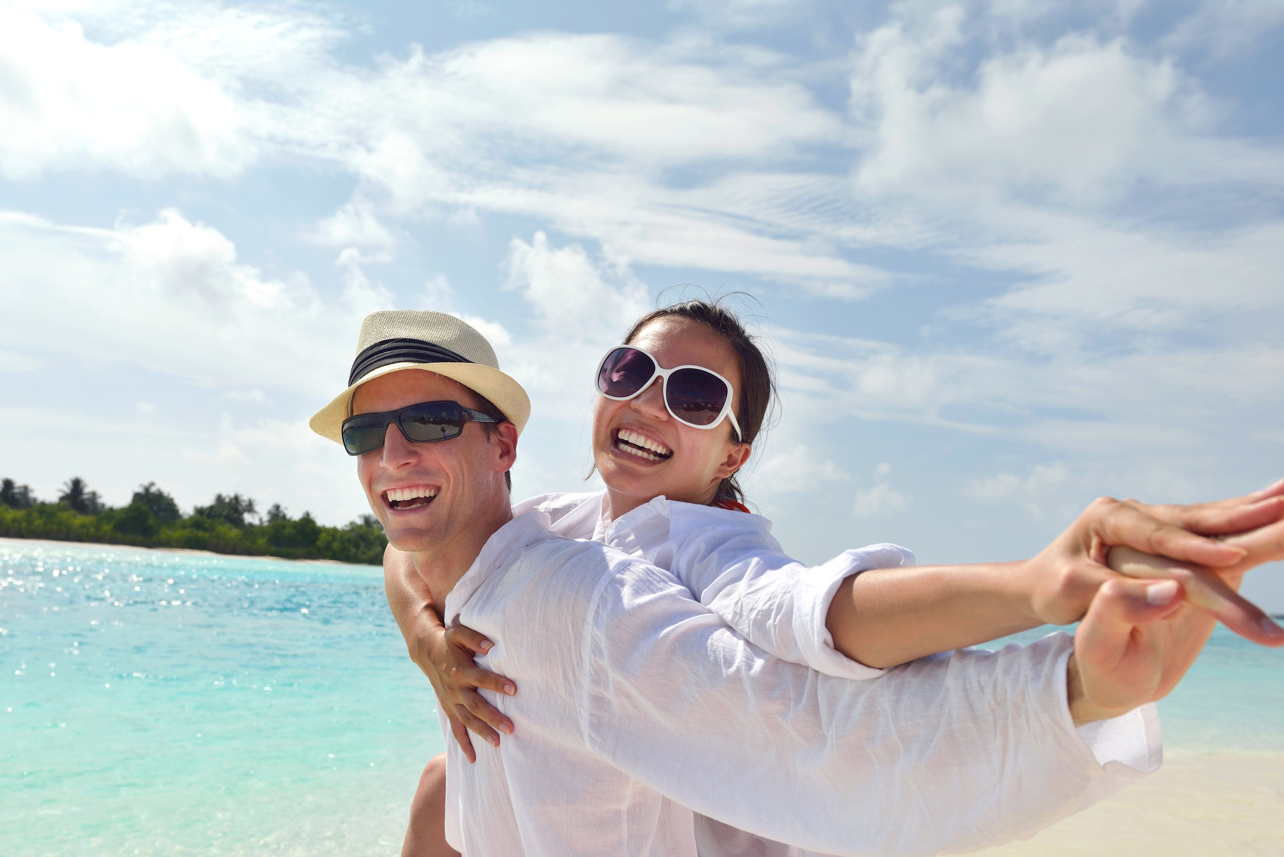 happy young romantic couple in love have fun running and relaxing on beautiful beach