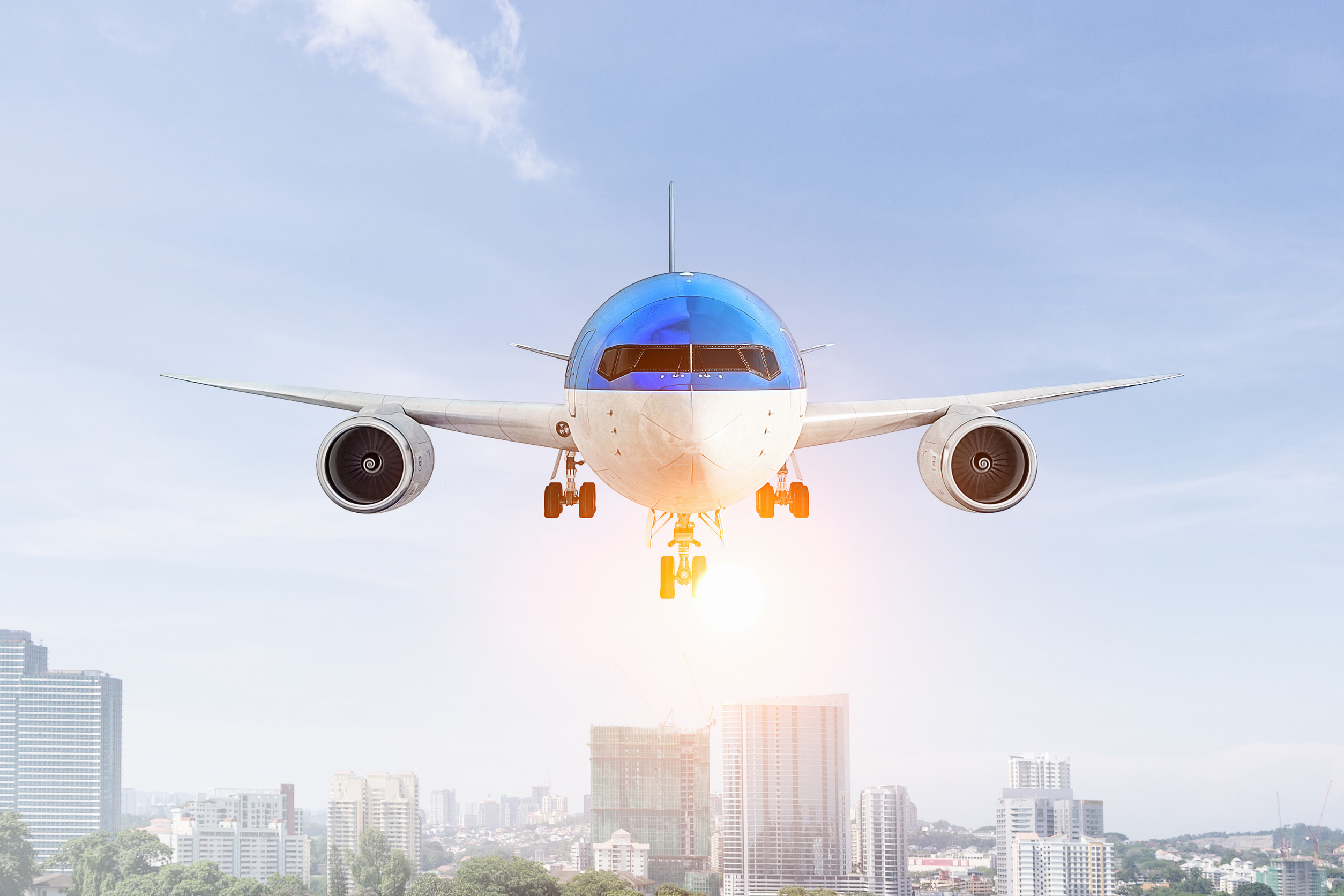 Airplane flying high in blue sky. 