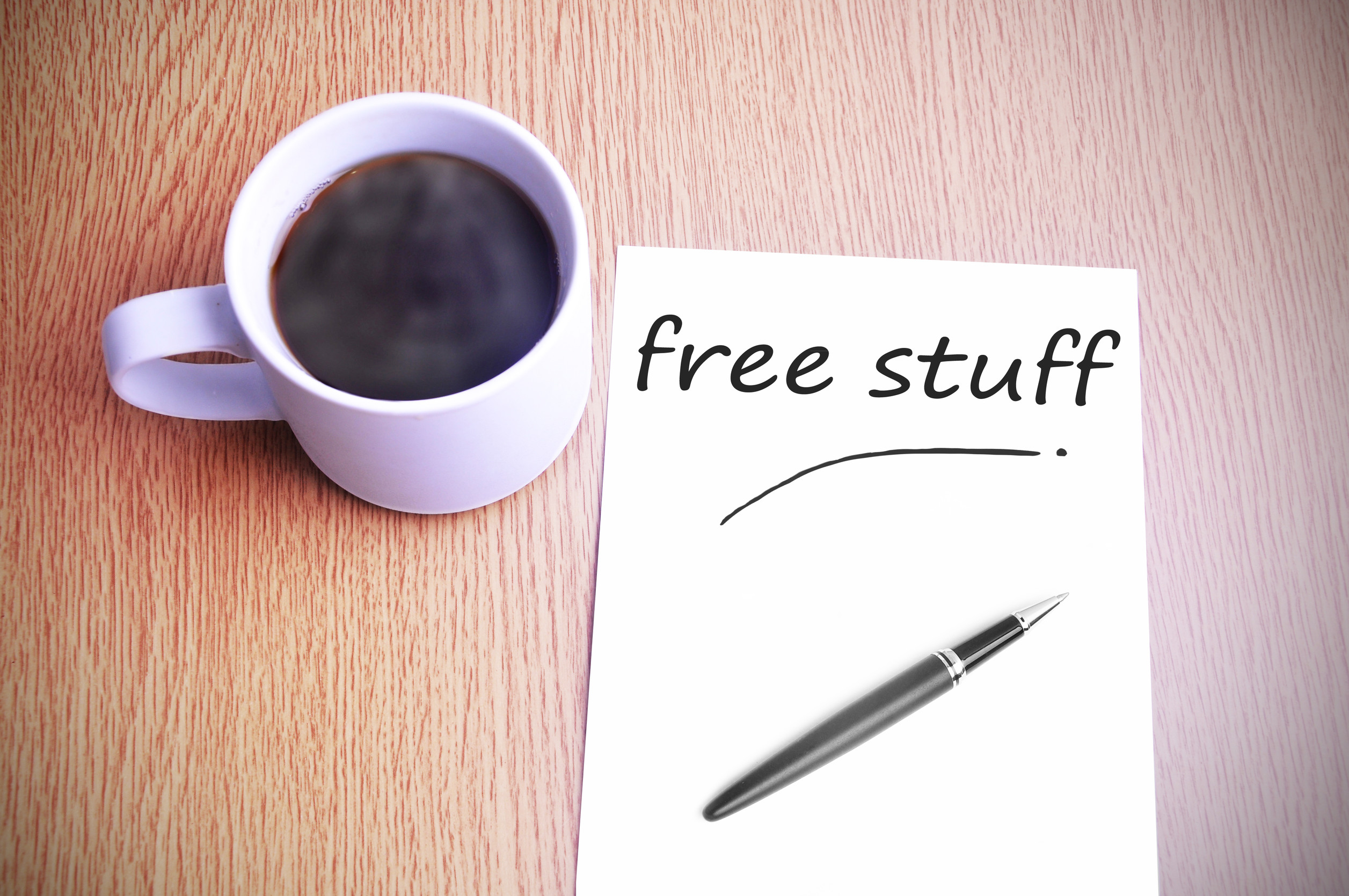 Black coffee on the table with note writing free stuff